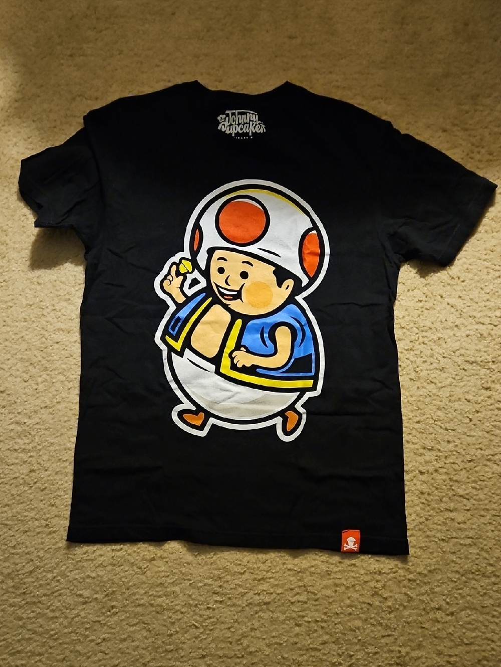 Johnny Cupcakes Black Tee with Bold White Logo and Multicolor Target Print